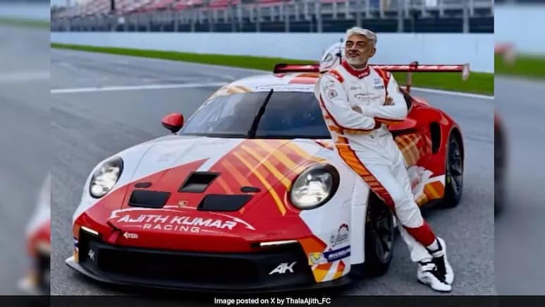 Ajith Kumar Poses with His Race Car At Barcelona F1 Circuit